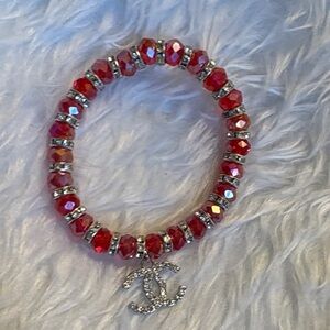 Elegant Red Beaded Bracelet with Silver Charm